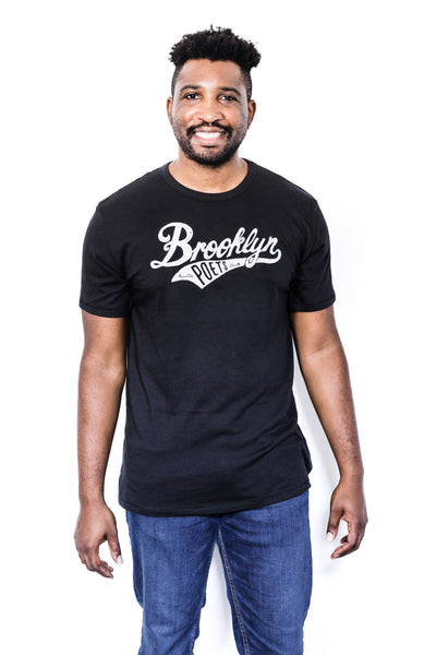 Front of Black male model wearing a Brooklyn Poets baseball tee