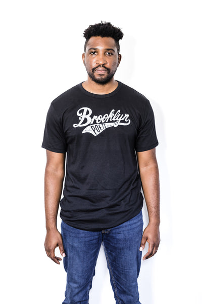 Front of Black male model wearing a Brooklyn Poets baseball tee